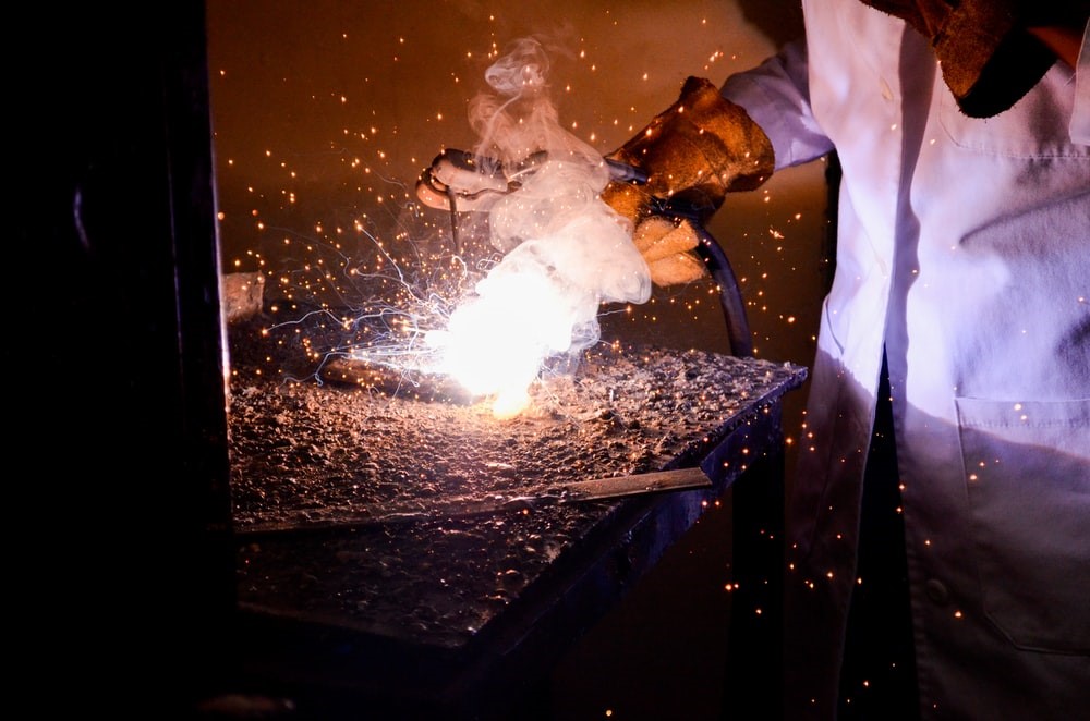 A person using a welding machine